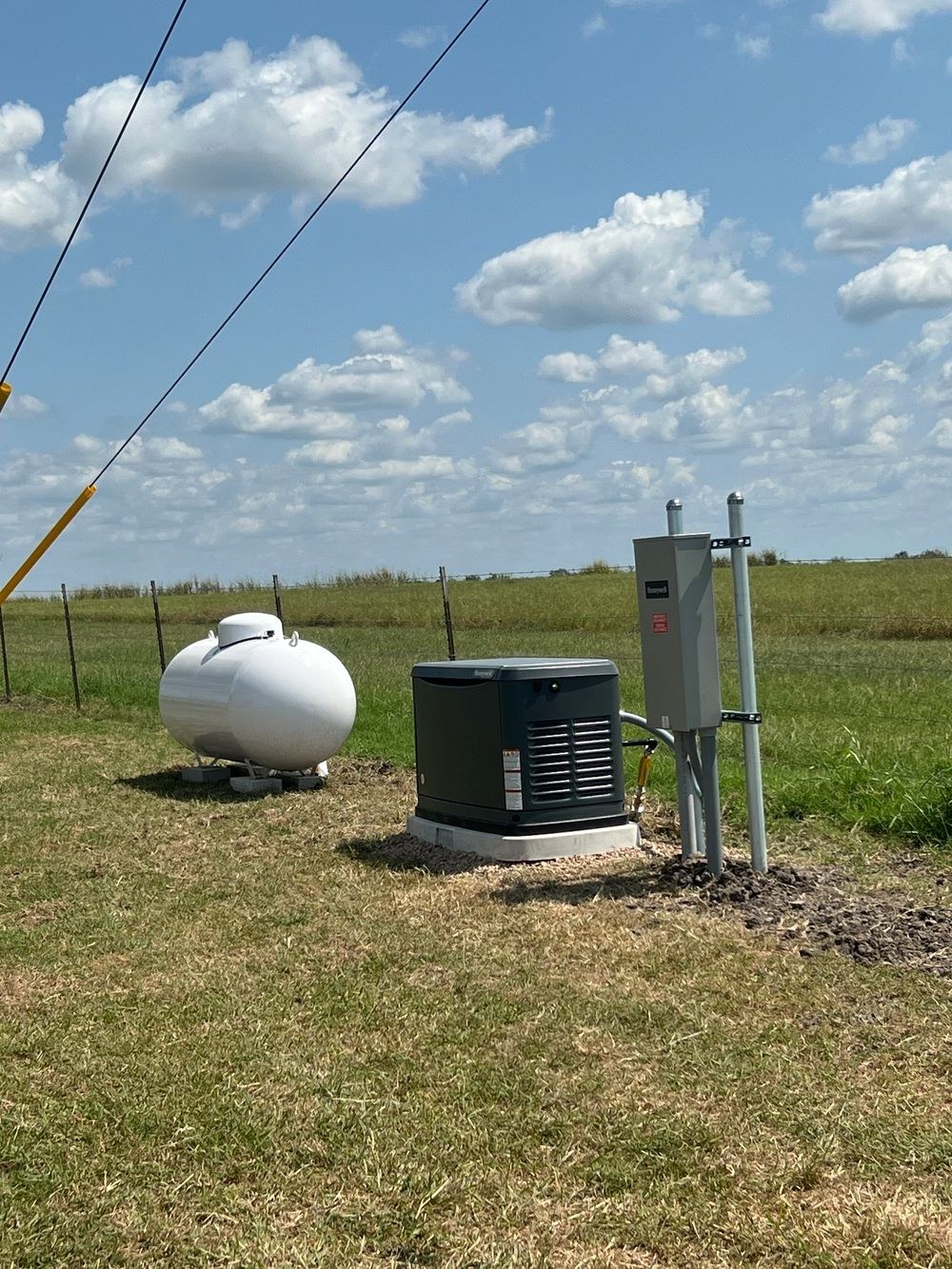 Complete rural Texas generator installation with propane tank and electrical connections